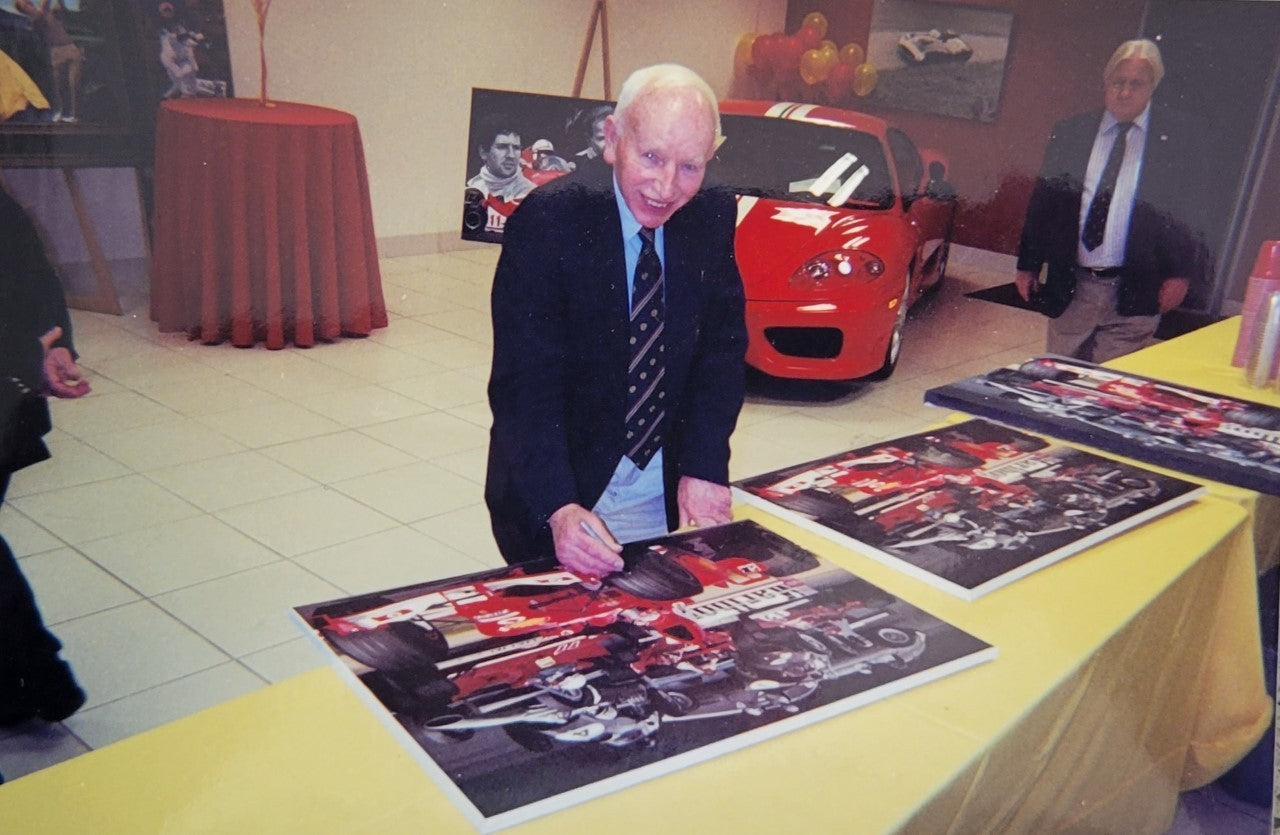 Ferrari World Champions — | Signed by Phil Hill & John Surtees